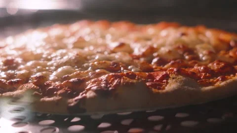 Cheese and Tomato Pizza Bubbling Slowly Whilst Cooking in Oven Stock Footage 337131769