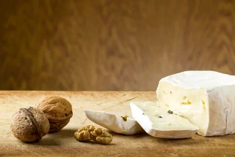 Cheese and walnuts Stock Photos