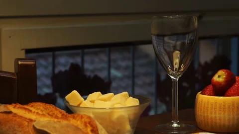 Cheese and wine tasting. Two glasses with red wine, grapes and cheese skewers on Video stock 88971549