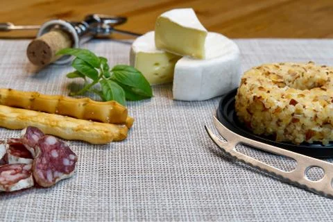 Cheese appetizer selection or Cheese and wine party table. Brie cheese, bread Stock Photos