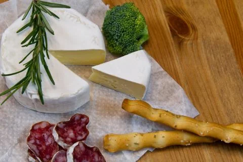 Cheese appetizer selection or Cheese and wine party table. Brie cheese, bread Stock Photos
