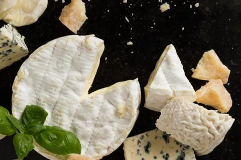 Cheese assorted on a table background. Variety sorts for appetizing, gourmet Stock Photos