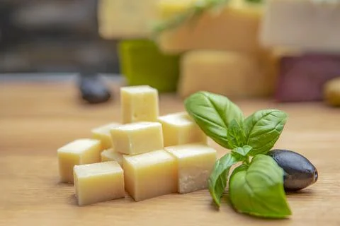 Cheese background. Assortment of different types of cheese on a wooden backgr Stock Photos
