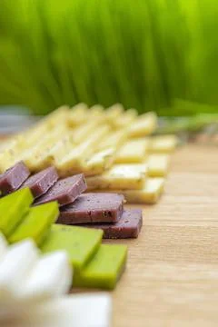 Cheese background. Assortment of different types of cheese on a wooden backgr Stock Photos