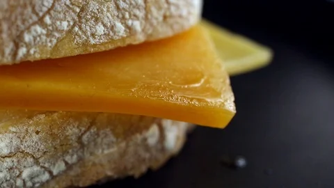 Cheese baked with bread macro view timelapse Video stock 104974647