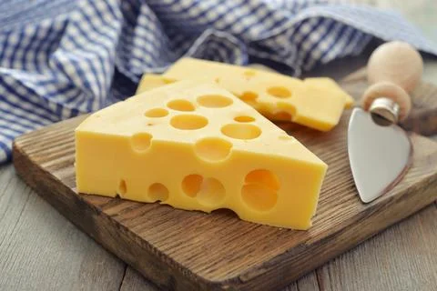 Cheese with big holes Stock Photos