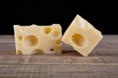 Cheese on a black background Stock Photos