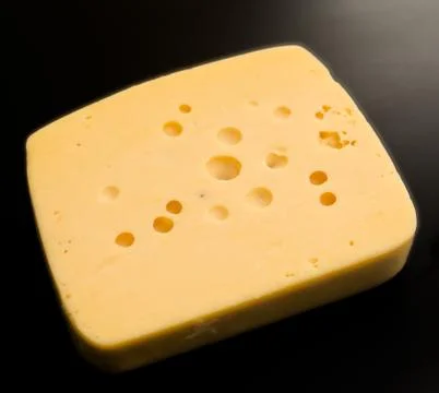 Cheese on black Stock Photos
