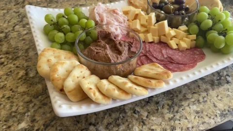 Cheese board with meat and crackers. Видео 200480361