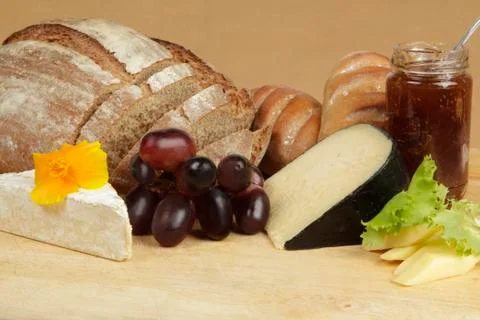Cheese board with rye bread and fruit Stock Photos
