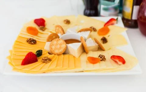 Cheese board on table Stock Photos