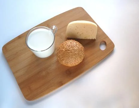 Cheese, bread and milk Stock Photos
