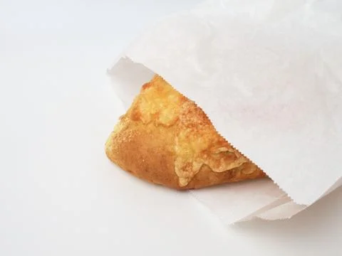 Cheese bread, packed in a paper bag, isolated on white Stockfoto's