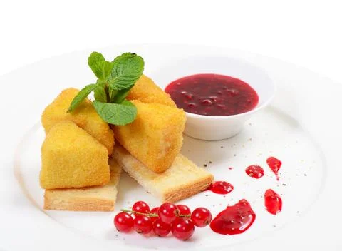 Cheese in breadcrumbs with currant jam Stock Photos