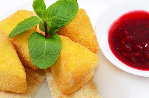 Cheese in breadcrumbs with currant jam Stock Photos