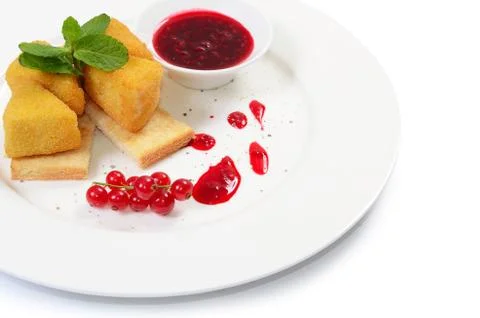 Cheese in breadcrumbs with currant jam Stock Photos