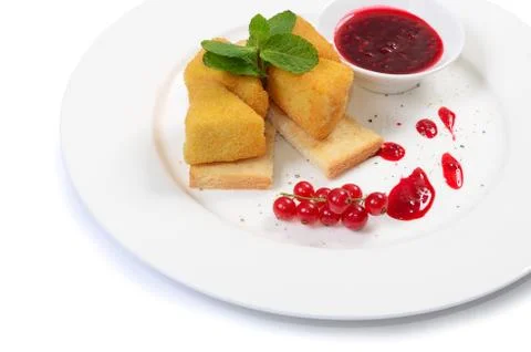 Cheese in breadcrumbs with currant jam Stock Photos