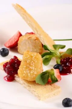 Cheese in breadcrumbs with currant jam Stock Photos