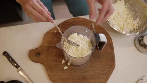 Cheese breakfast. On the table is a food processor with ingredients cottage Stock-Footage 155072507