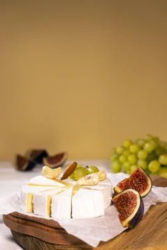 Cheese Brie type Camembert with fig nuts and grape on wooden baord, Healthy Stock Photos