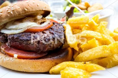 Cheese burger - American cheese burger with Golden French fries Stock Photos