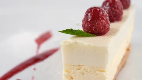 Cheese cake with fresh raspberries, close-up view Stock Footage 79984886