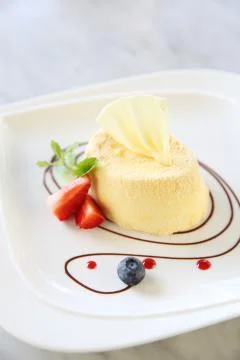 Cheese cake with fruits Stock Photos