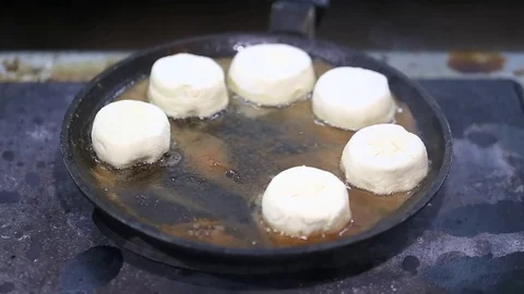 Cheese cakes fried in a pan Video stock 72857728