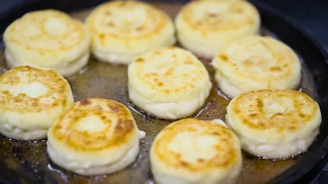 Cheese cakes fried in a pan Video stock 75957684