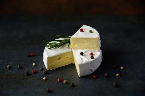 Cheese camembert or brie with fresh rosemary Stock Photos