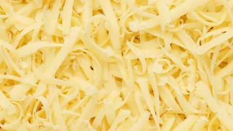 Cheese chopped - background. Grated cheese, dolly shot. Stock Footage 143500258