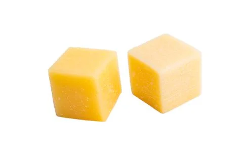 Cheese cubes isolated Stock Photos