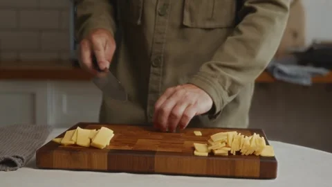 Cheese cubes as part of mindful cooking Stock Footage 317990422