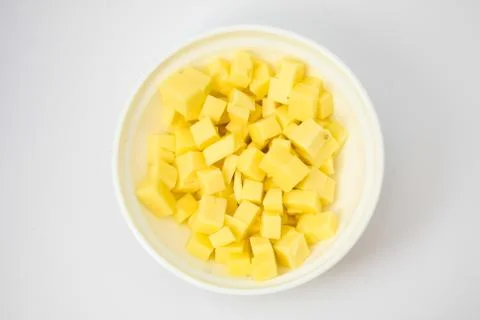 Cheese cubes in the pot Stock Photos
