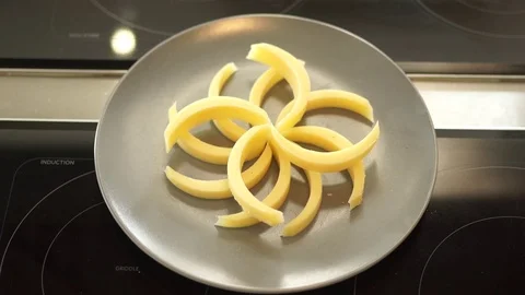 Cheese cut into patterned slices Stock Footage 71504422