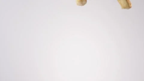 Cheese danish pastries raining on white slow motion macro food studio 4K stock Stock Footage 337909881