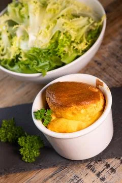 Cheese egg souffle on rustic cloth on a wooden background Foto stock