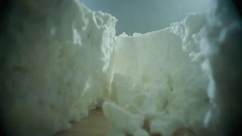 Cheese fall into iceberg laowa macro Stock Footage 197702947