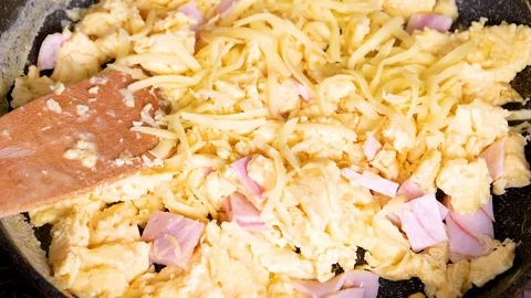 Cheese falling on omelette in slow motion Stock Footage 91103329