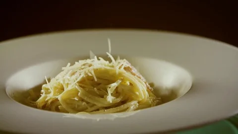 Cheese falling on pasta macaroni closeup slow motion Stock Footage 71923837