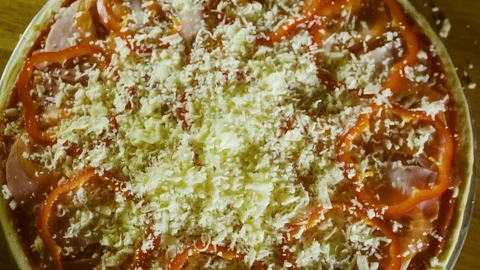 Cheese falling on pizza closeup slow motion Stock Footage 71923402
