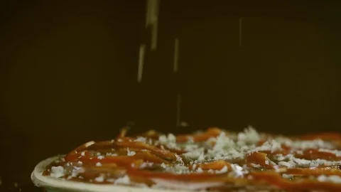 Cheese falling on pizza closeup slow motion Stock-Footage 71923694