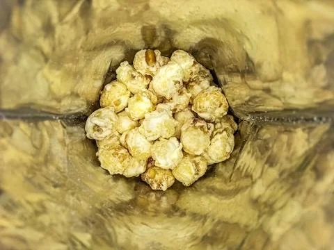 Cheese flavored popcorn in plastic packaging Stock Photos