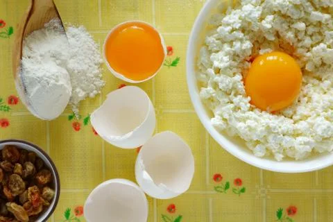 Cheese, flour and eggs on the table Stock Photos