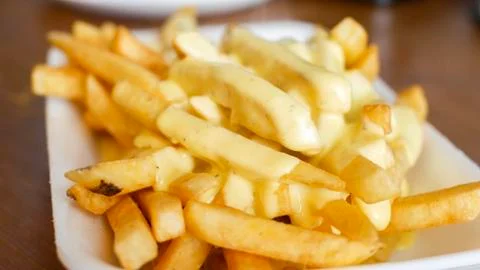 Cheese on frying pan Stock Photos