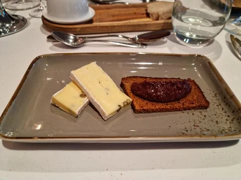 Cheese, gingerbread and marmalade dish on fine dining resturant Stock Photos