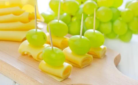 Cheese with grape Stock Photos