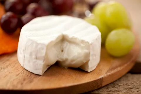 Cheese with grapes Stock Photos
