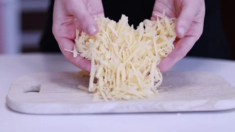 Cheese grated on a grater Stock Footage 169252688