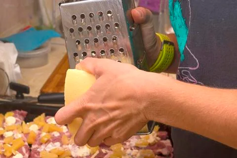 Cheese grinding close-up Stock Photos